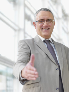 Businessman extending hand to shake. Date : 2008