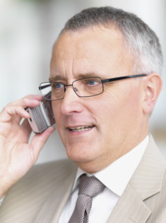 Businessman talking on cell phone. Date : 2008