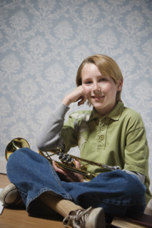 Boy holding trumpet. Date : 2008