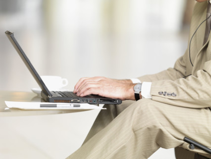 Businessman typing on laptop. Date : 2008