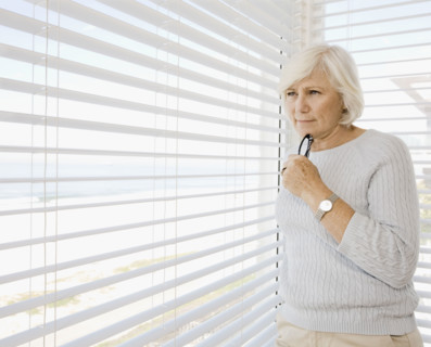 Woman looking out window. Date : 2008