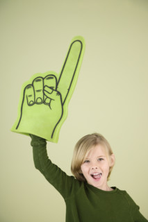 Boy holding foam Number One hand. Date : 2008