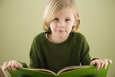 Boy holding book. Date : 2008