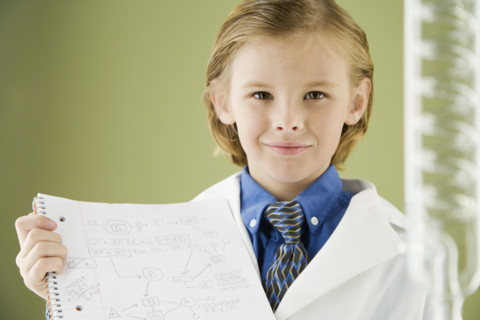 Boy holding science notebook. Date : 2008