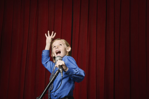 Boy singing on stage. Date : 2008
