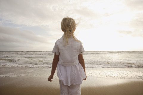 Girl looking out at ocean. Date : 2008