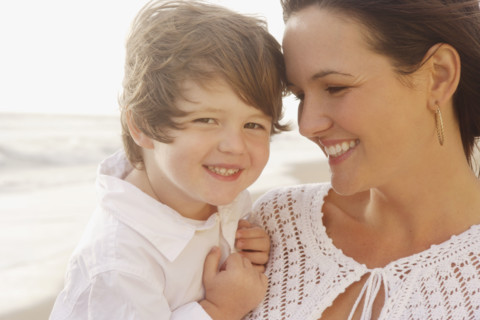 Close up of mother and son smiling. Date : 2008
