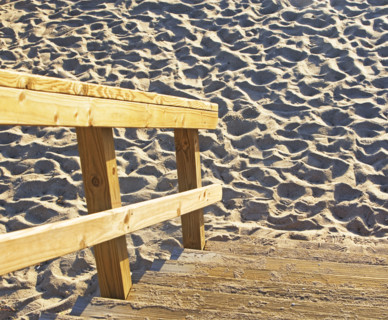 Wooden steps down to sand. Date : 2008