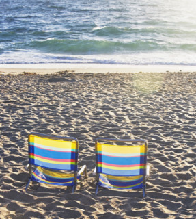 Empty beach chairs on sand. Date : 2008