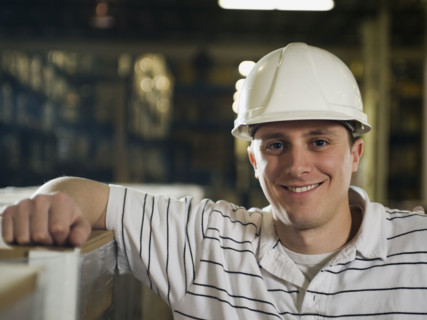 Warehouse worker wearing hard hat. Date : 2008
