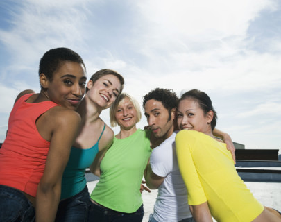 Multi-ethnic friends hugging. Date : 2008