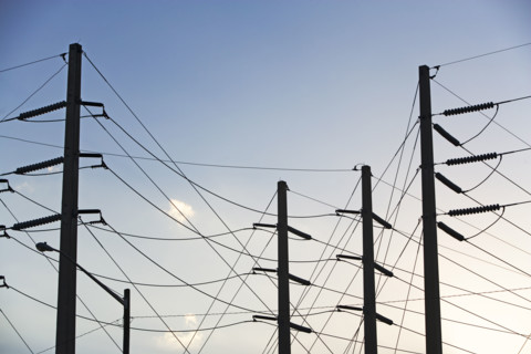 Low angle view of power lines on poles. Date : 2008