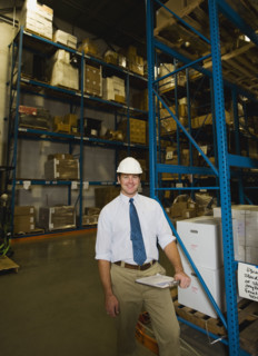 Warehouse worker with clipboard. Date : 2008