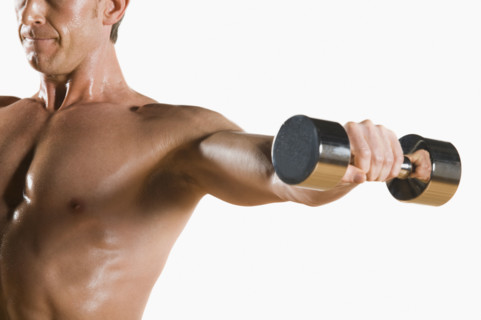 Male body builder flexing lifting weight. Date : 2008