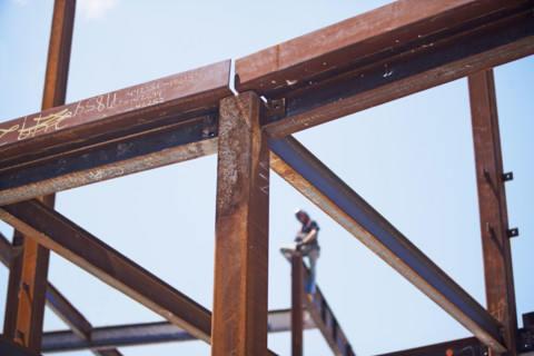 Construction worker on steel beam at construction site. Date : 2008