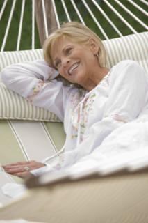 Woman relaxing in hammock.