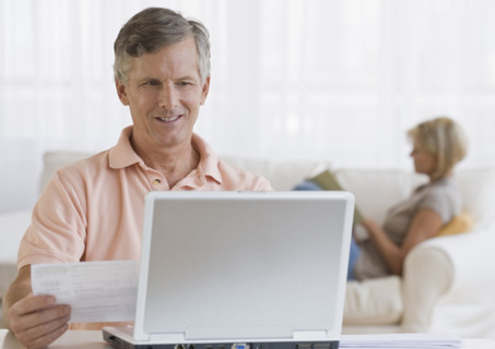 Man paying bills online.
