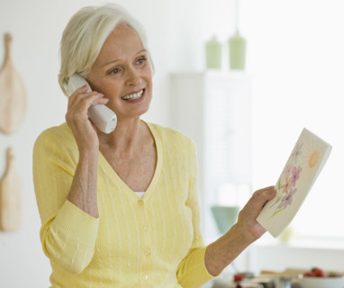 Woman talking on telephone.