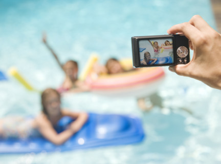 Person photographing girls in swimming pool. Date : 2008