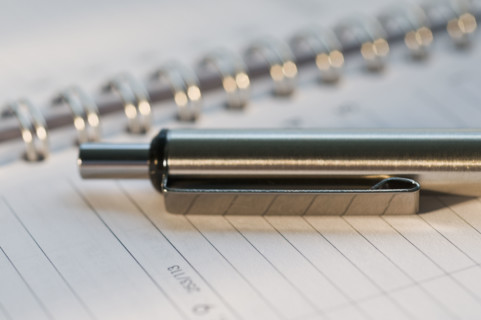 Close up of pen and organizer. Date : 2008