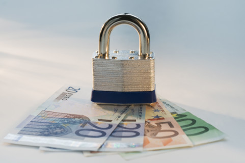Close up lock and paper euros. Date : 2008