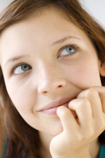 Close up of teenage girl daydreaming. Date : 2008