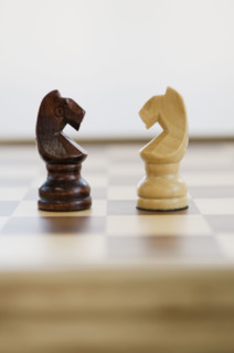 Opposing knight chess pieces. Date : 2008