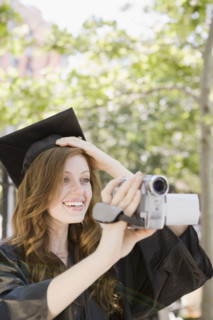 Female graduate filming ceremony. Date : 2008