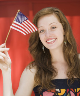 Young woman holding American flag. Date : 2008