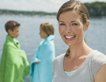 Mother and children on dock.