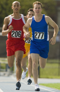 Runners racing on track.