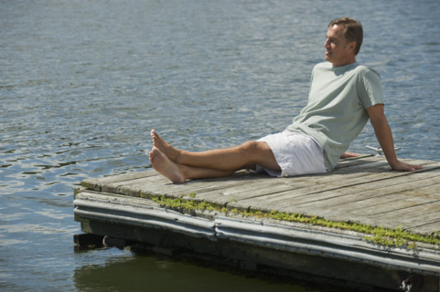 Man sitting on dock.