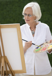 Senior woman painting.