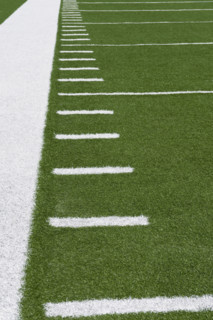 Yard line markers on football field.