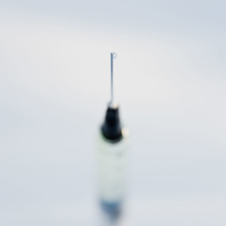 Close up of syringe.