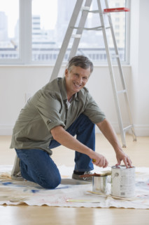 Man painting room.