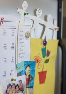 Assorted decorations on refrigerator.