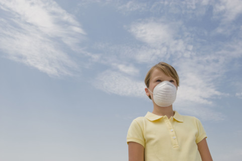 Girl wearing dust mask.