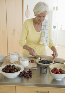 Senior woman making pies.