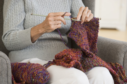 Senior woman knitting.