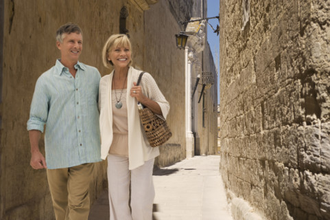 Tourists walking in alley.