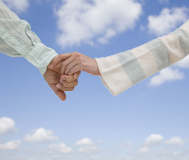 Couple holding hands.