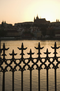 Silhouetted fence post and river.