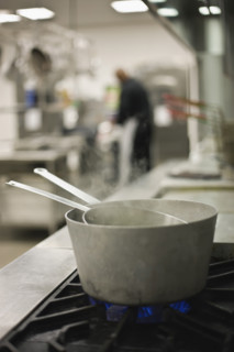 Steaming pots on gas stove. Date : 2008