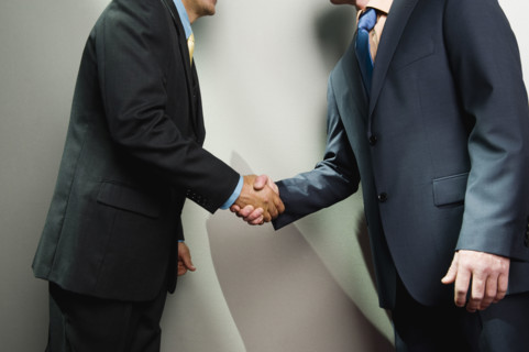 Businessmen shaking hands. Date : 2008