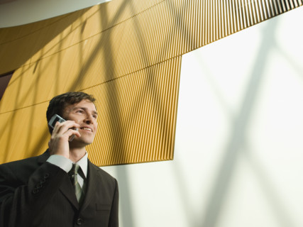 Businessman talking on cell phone. Date : 2008