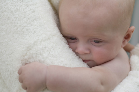 Mother hugging baby boy. Date : 2008