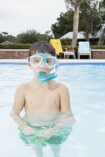 Boy snorkeling in swimming pool. Date : 2008