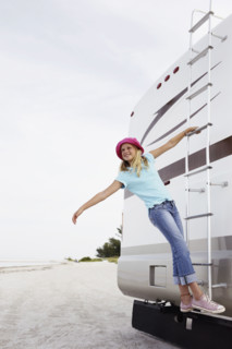 Girl climbing on motor home ladder. Date : 2008