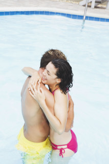 Couple hugging in swimming pool. Date : 2008